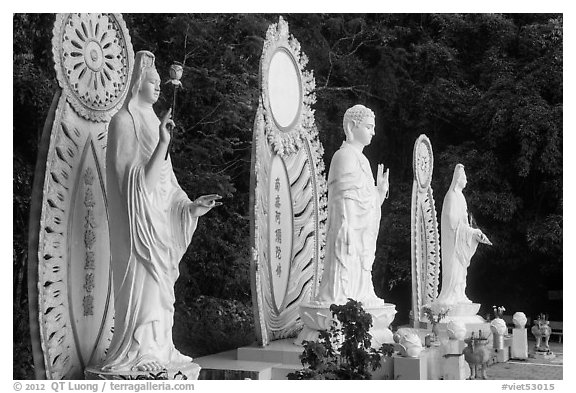 Three Buddhist statues. Ta Cu Mountain, Vietnam (black and white)