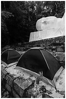 Child and tents set up below head of Buddha statue. Ta Cu Mountain, Vietnam (black and white)