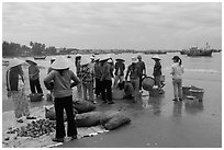 Shore activity in front of Lang Chai fishing village. Mui Ne, Vietnam (black and white)