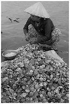 Woman opening scallops. Mui Ne, Vietnam ( black and white)