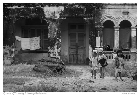 Children in front of home. Mui Ne, Vietnam (black and white)