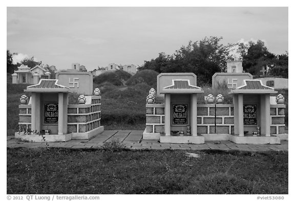 Mix of Buddhist and Christian tombs. Mui Ne, Vietnam