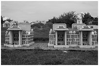 Mix of Buddhist and Christian tombs. Mui Ne, Vietnam ( black and white)