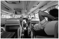 Inside bus with reclining seats for sleeping. Vietnam (black and white)