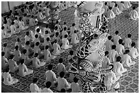 Column and worshippers, Cao Dai Holy See temple. Tay Ninh, Vietnam (black and white)