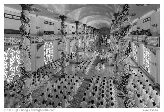 Noon ceremony inside Cao Dai Holy See temple. Tay Ninh, Vietnam (black and white)