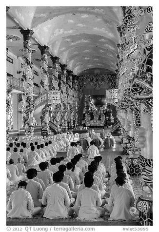 Rows of worshippers in Cao Dai Holy See. Tay Ninh, Vietnam (black and white)