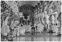 Cao Dai followers during a service inside Holy See. Tay Ninh, Vietnam ( black and white)