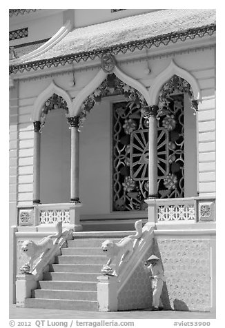 Cao Dai follower and temple detail. Tay Ninh, Vietnam