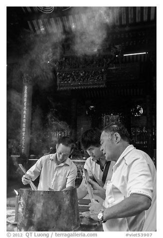 Worshippers burning incense, Thien Hau Pagoda. Cholon, District 5, Ho Chi Minh City, Vietnam (black and white)