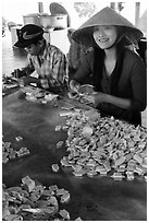 Villagers wrapping coconut candy, Phoenix Island. My Tho, Vietnam ( black and white)