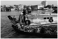 People buying fruit on boats, Cai Rang floating market. Can Tho, Vietnam (black and white)