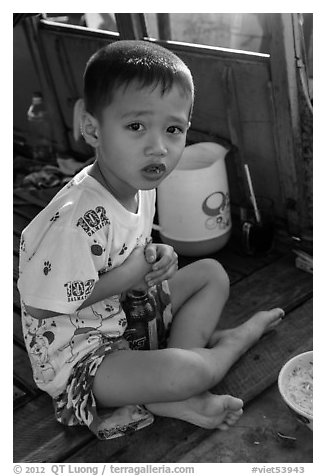 Boy on barge. Can Tho, Vietnam (black and white)