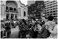 Families gather on moterbikes to watch musical performance. Ho Chi Minh City, Vietnam (black and white)