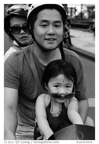 Family on motorbike with sunglasses. Ho Chi Minh City, Vietnam (black and white)