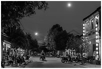 Street at dusk with moon and lanterns. Hoi An, Vietnam (black and white)