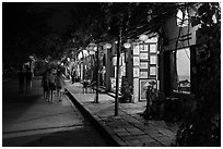 Street lined with art galleries by night. Hoi An, Vietnam (black and white)