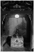 Monkey altar lit by lantern, Japanese Bridge. Hoi An, Vietnam (black and white)