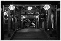 View through the inside of Covered Japanese Bridge at night. Hoi An, Vietnam (black and white)