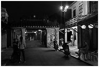 Night street scene near the Japanese Bridge. Hoi An, Vietnam (black and white)