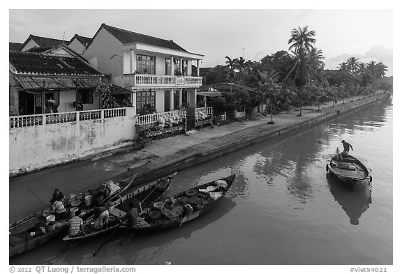 Waterfront with people selling from boats. Hoi An, Vietnam