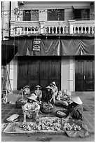 Banana vendors and historic house. Hoi An, Vietnam (black and white)