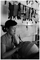 Woman working on paper lantern. Hoi An, Vietnam (black and white)