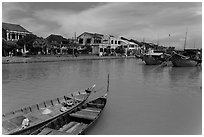 Boats, Thu Bon River, and houses. Hoi An, Vietnam ( black and white)