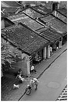 Old houses with tile rooftops and street from above. Hoi An, Vietnam (black and white)