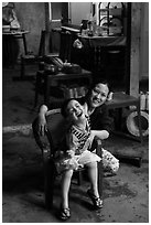 Boy and woman in kitchen. Hoi An, Vietnam (black and white)