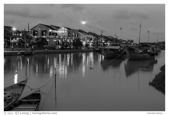 Waterfront, boats, and Thu Bon River at dusk. Hoi An, Vietnam (black and white)