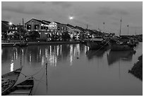 Waterfront, boats, and Thu Bon River at dusk. Hoi An, Vietnam (black and white)