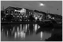 Moonrise over houses and river. Hoi An, Vietnam (black and white)
