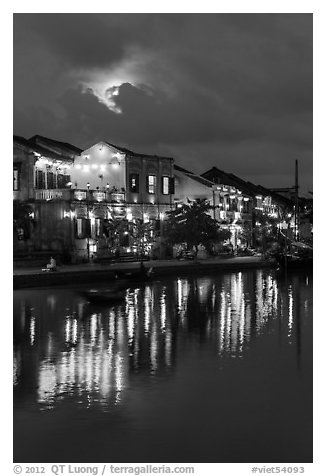 Ancient townhouses and moon reflected in river. Hoi An, Vietnam