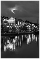 Ancient townhouses and moon reflected in river. Hoi An, Vietnam (black and white)