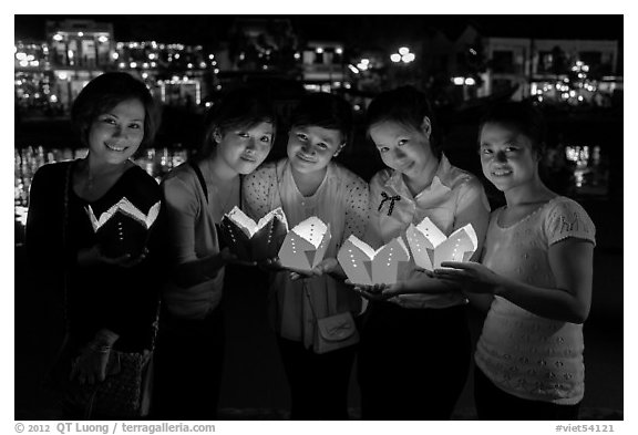 Group of women holding candles. Hoi An, Vietnam (black and white)