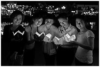 Group of women holding candles. Hoi An, Vietnam (black and white)