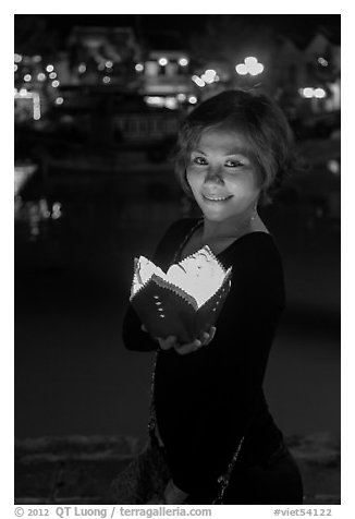 Young woman with candle box. Hoi An, Vietnam