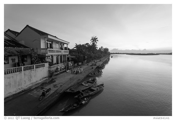 Sunrise over river and waterfront houses. Hoi An, Vietnam (black and white)