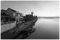 Sunrise over river and waterfront houses. Hoi An, Vietnam (black and white)