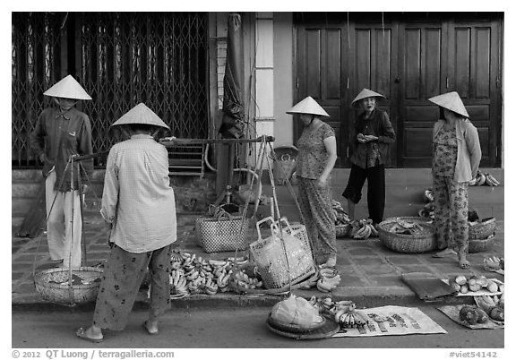 Curbside fruit vendors. Hoi An, Vietnam (black and white)