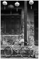 Bicycle and facade with lanterns. Hoi An, Vietnam (black and white)