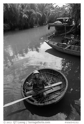 Man in circular boat near Cam Kim Village. Hoi An, Vietnam