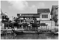 Road and river petrol station. Hoi An, Vietnam ( black and white)