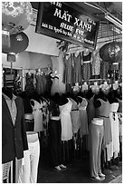 Colorful outfits and lanterns in textile shop. Hoi An, Vietnam ( black and white)