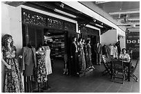 Man sitting outside textile store. Hoi An, Vietnam ( black and white)