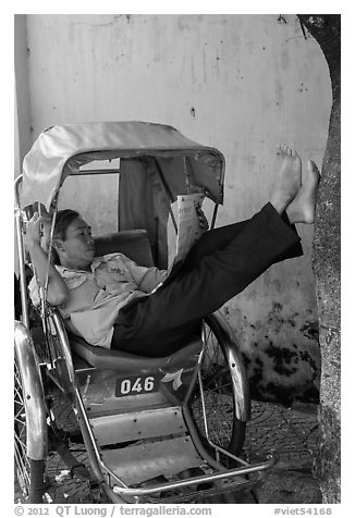 Cyclo driver relaxing. Hoi An, Vietnam (black and white)