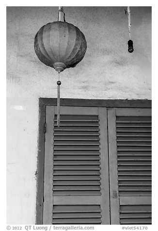 Paper lantern, wall, and blue shutters. Hoi An, Vietnam (black and white)