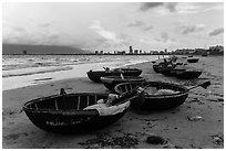 Coracle boats and city skyline. Da Nang, Vietnam ( black and white)