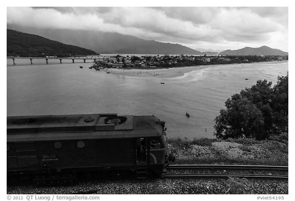 Train, bay, and village. Vietnam (black and white)